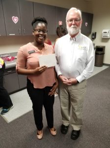 Eve-Lyndssa Oxley, left, receiving COS USPS Recognition Award from COS Dean Michael Johnson, right.