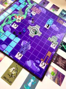 A colorful board game with character pieces on a purple, grid-based map. Player cards with character art are arranged around the board.